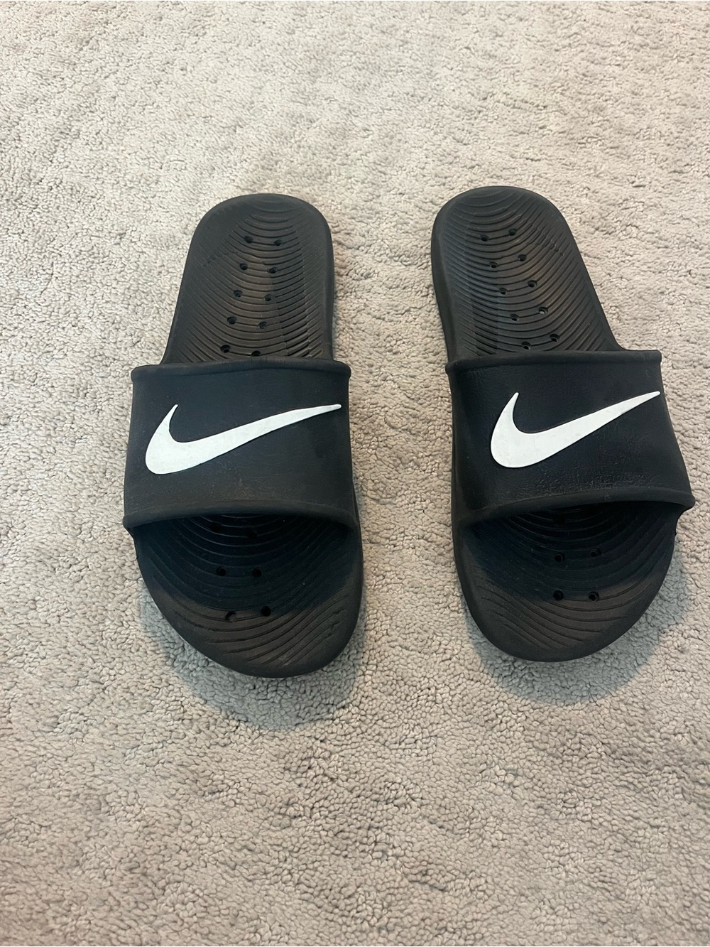 Nike Black Slides with White Swoosh Logo